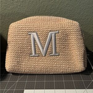 Beige Pouch with Monogram M. Feels like knit straw but may just be plastic